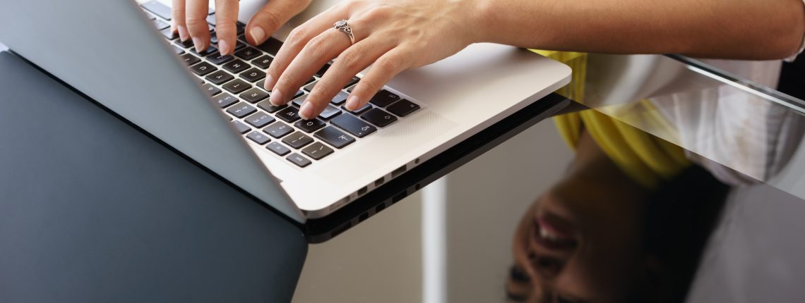 person typing on a computer