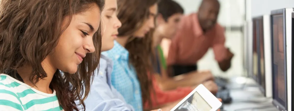 students using technology tools in a classroom