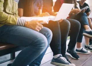 Students sitting in the bleachers