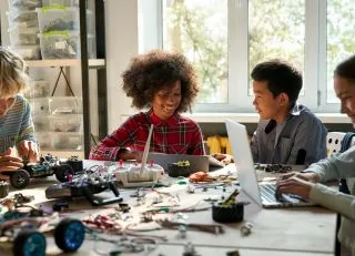 Group of students building robotics models.