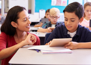 Teacher working with student