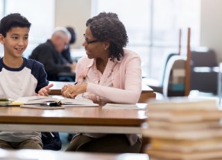 Student working with a teacher